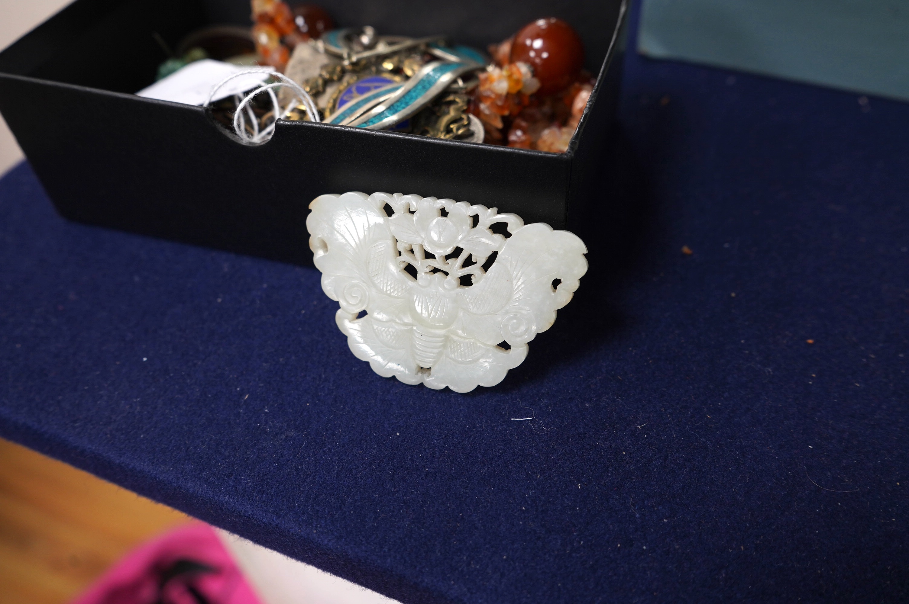 A Chinese reticulated jade ‘butterfly’ plaque , late Qing dynasty, 7cm wide. Condition - good